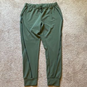 NeNe Leakes jogger pants size XL. Olive green black faux leather side stripe.